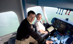 Tom Haines joins pilot Fritz Gunther at the controls