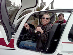 AOPA Let's Go Flying Cirrus SR22 Sweepstakes winner Michael Graves dangles the keys to his new ride.