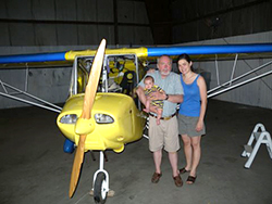 Lance Anderson holds his grandson Nicholas while his daughter Lisa stands by.