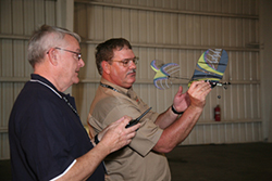 AOPA Pilot Senior Editor Al Marsh gets helpful hints from Tony Stillman, Academy of Model Aeronautics District 5 vice president.