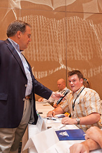 AOPA President Craig Fuller gets feedback from an attendee.