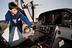 Children looking at the Let's Go Flying Sweeps plane