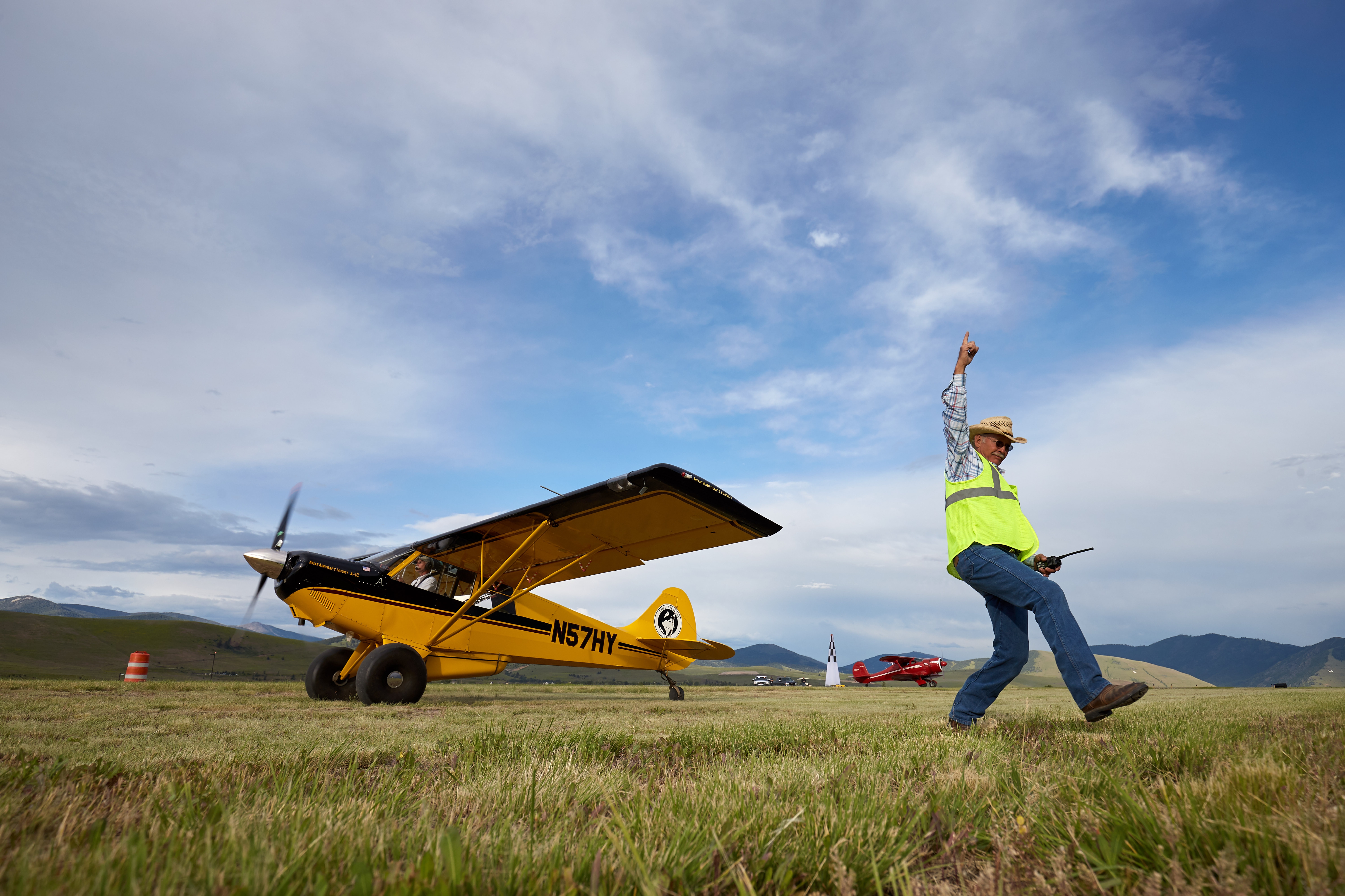 Texan Jimmie Gist, acting Aircraft Wrangler, orchestrates a STOL (Short Take Off and Landing) demonstration at the 2018 AOPA Fly In at Missoula.Missoula Airport (MSO)Missoula, MT
