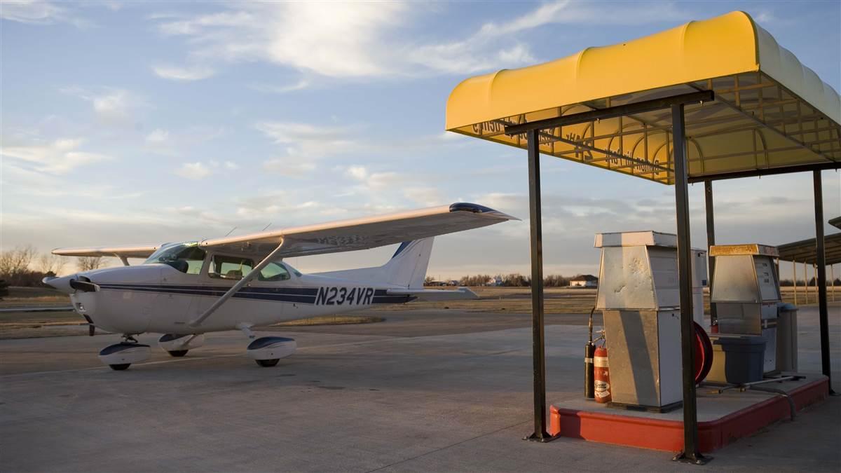 A Cessna 172 owner fuels his aircraft at a self serve fuel island.
Benton, KS   USA
Image#: 05-479_023.CR2
Camera: Canon EOS-1Ds Mark II 
http://mikefizer.com    mike@mikefizer.com