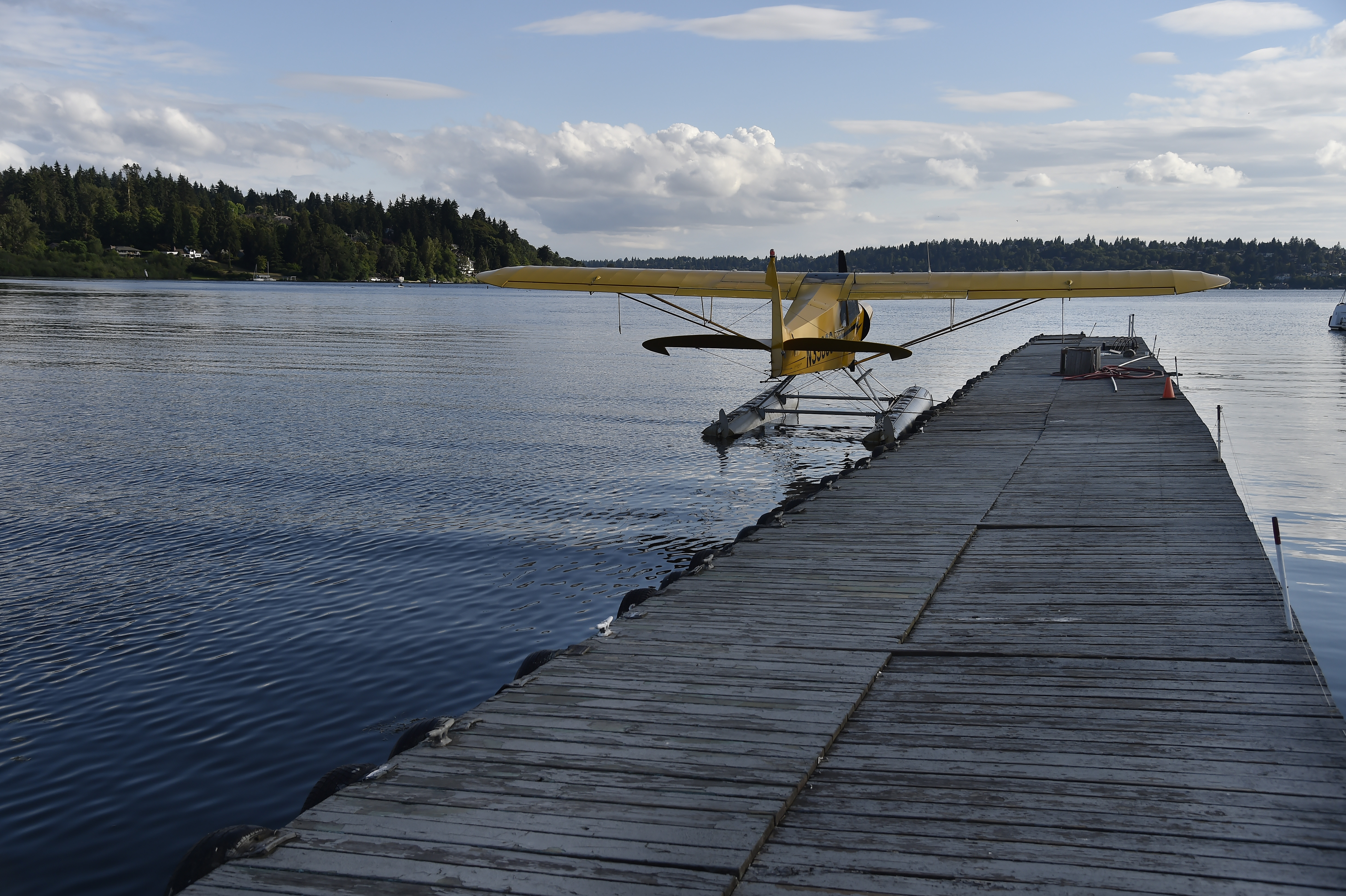 The sun sets near a Super Cub floatplane at Kenmore Air Harbor in Kenmore, Washington. Photo by David Tulis.