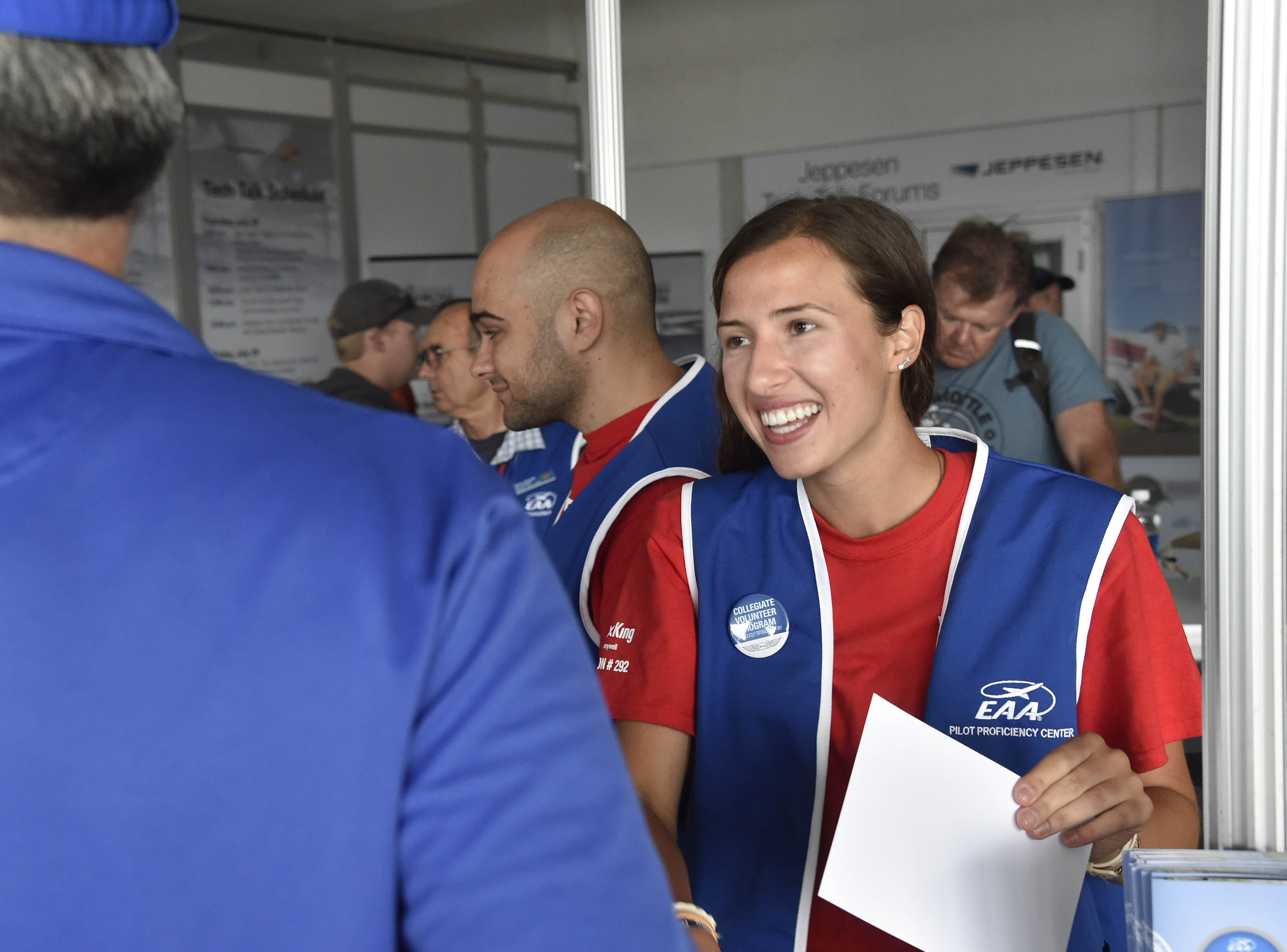 Private pilot Christine Oksas helps EAA AirVenture attendees at the Pilot Proficiency Center in Oshkosh July 29. Photo by David Tulis.