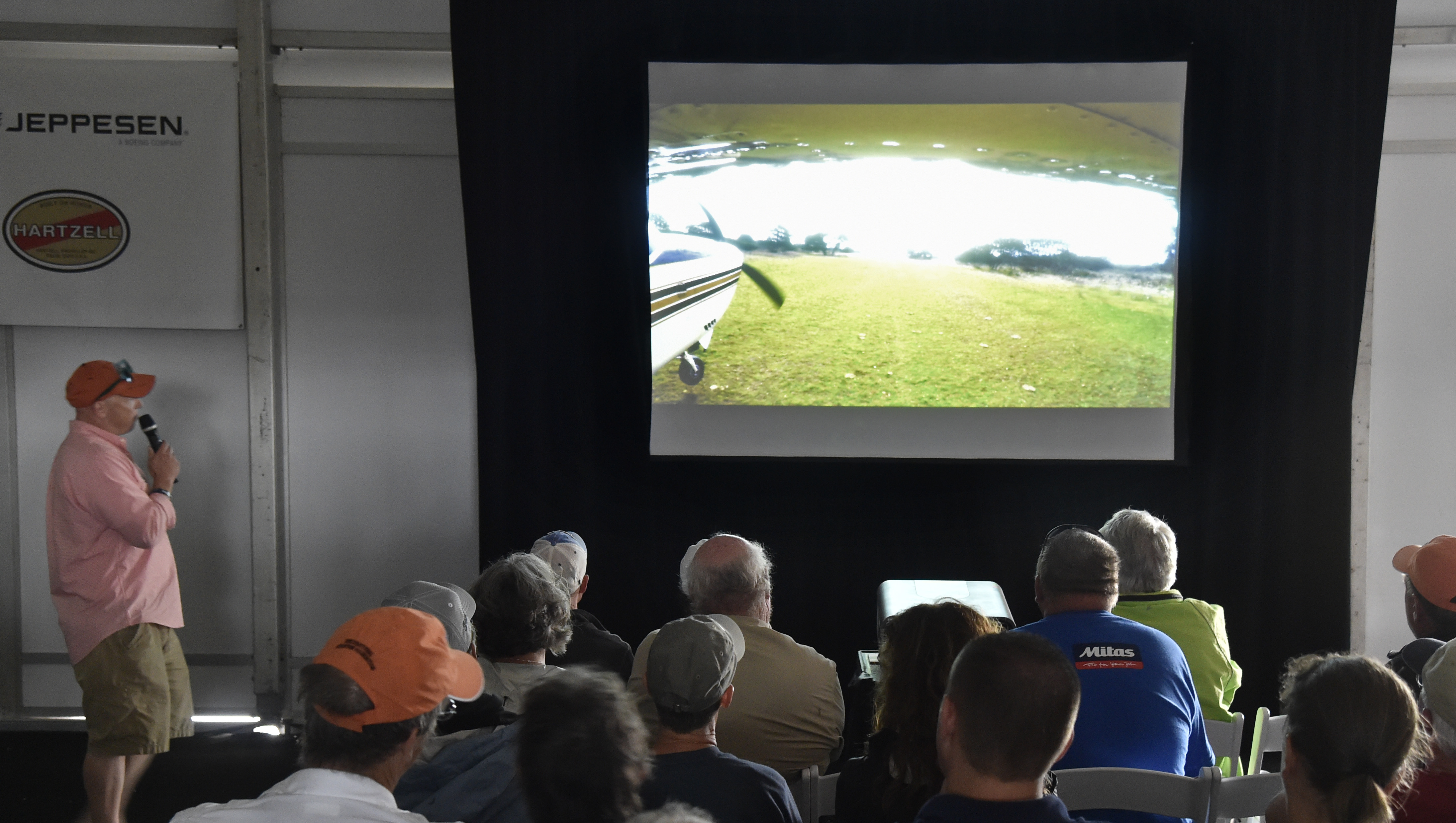 Pilots watch a Tech Talk presentation at EAA AirVenture's Pilot Proficiency Center. Jack Pelton, EAA CEO and chairman, said the association met its goal of 5,000 pilots passing through the learning facility. Photo by David Tulis.