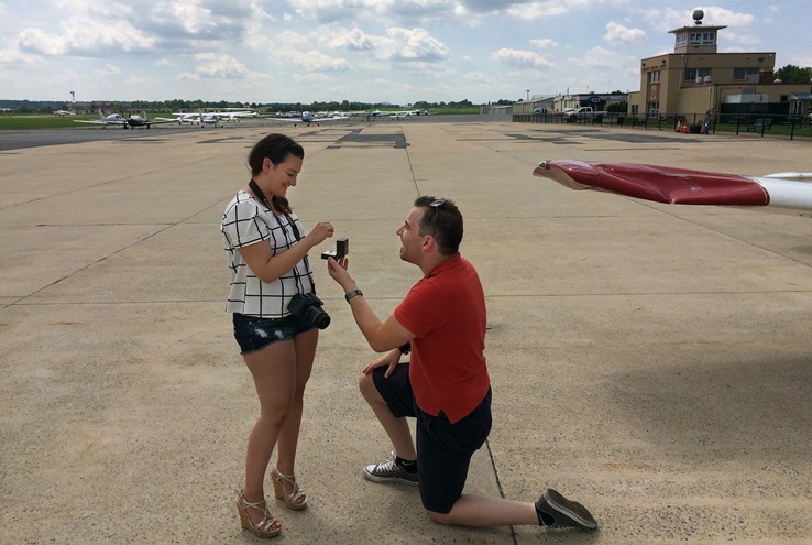 Pilot Ali Kaan Ozdemir asks Ambra Xhepa to marry him after a bird strike caused wing damage to the Octopus Flying Club's Piper Warrior and an emergency descent into Frederick Municipal Airport Aug. 26, in Frederick, Maryland. Photo courtesy of Rick Johnson, Frederick Municipal Airport.