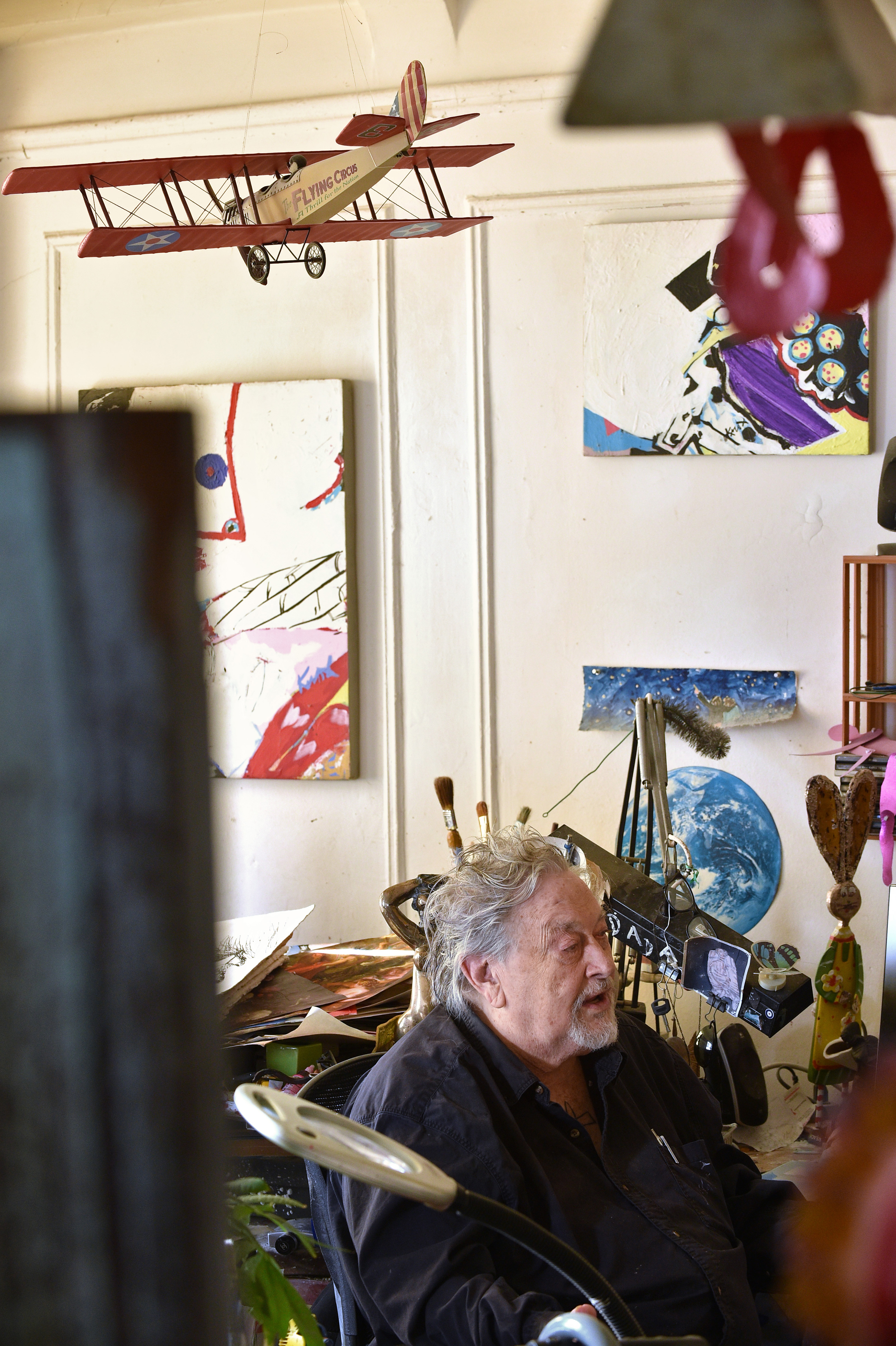 Aviation pioneer Knox Martin, who established air routes in South America during the 1910s and 1920s, had doodled in a long lost book that was delivered to his son, artist Knox Martin, shown surrounded by his artwork in New York City, Dec. 4. Photo by David Tulis.