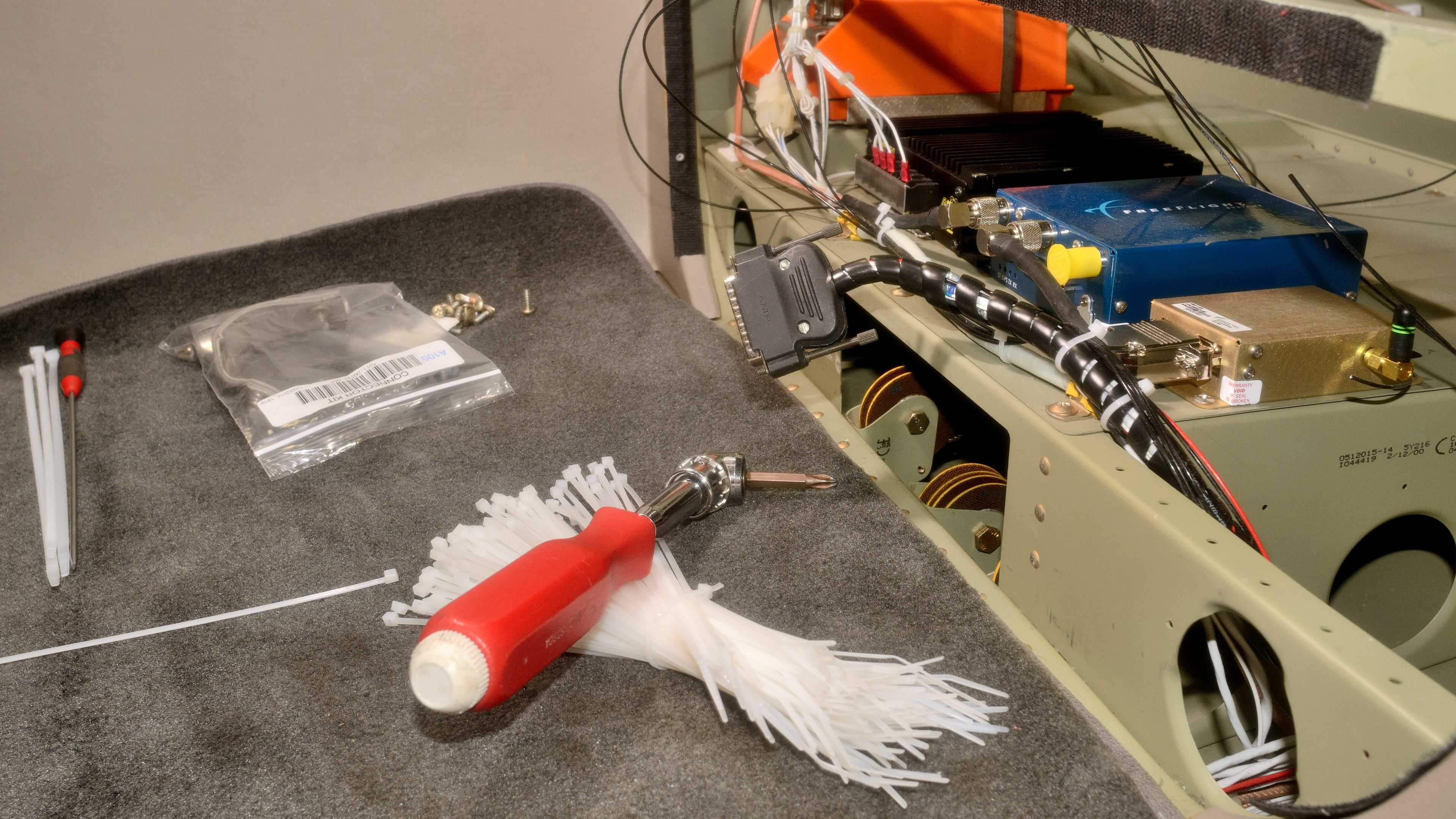 Lancaster Avionics technician Scott Kuhns has just installed a FreeFlight Systems universal access transceiver and Wi-Fi module behind the baggage compartment of a Cessna 172. The UAT will provide both ADS-B Out and In capabilities. Photo by Mike Collins.