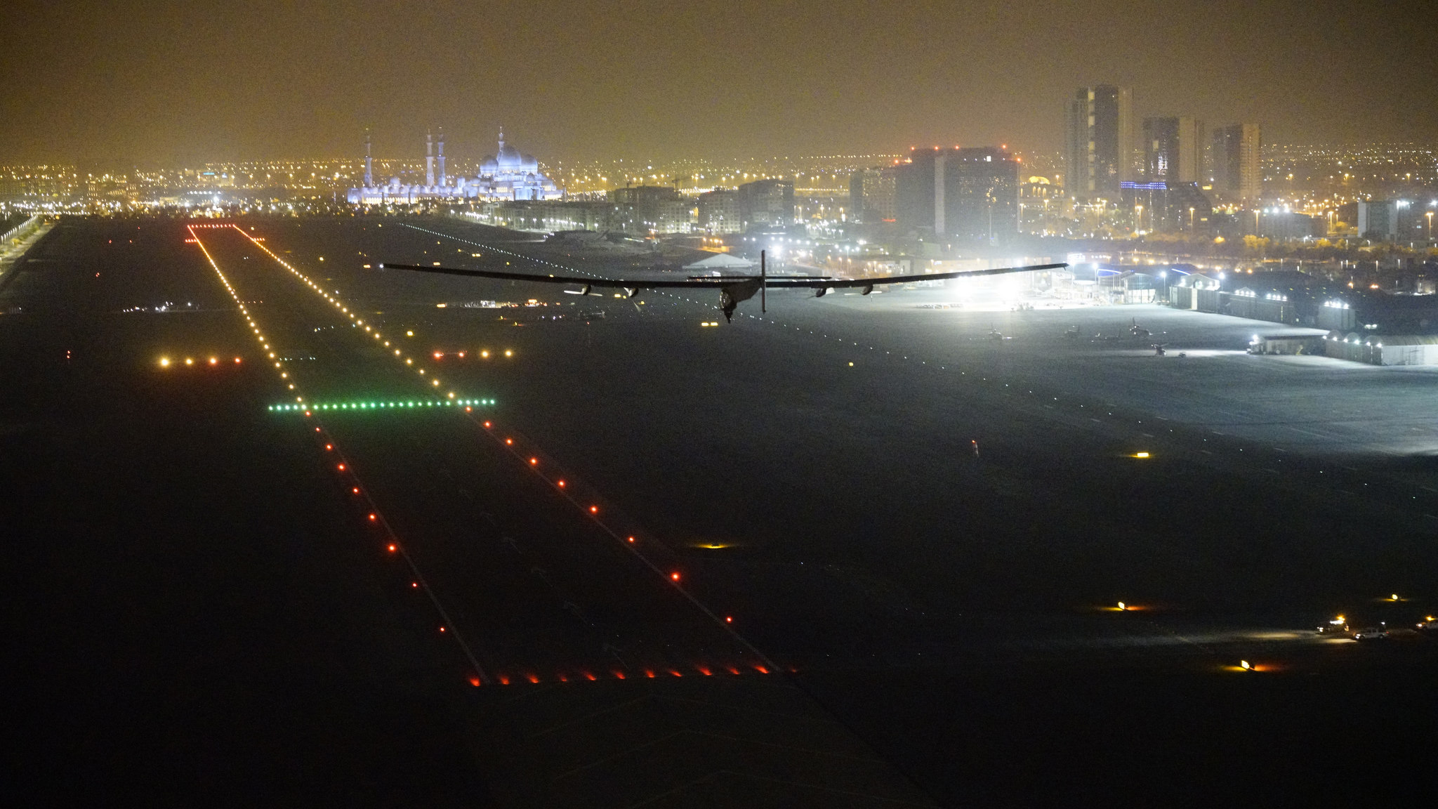 Solar Impulse 2 approaches to land in Abu Dhabi, concluding its round-the-world solar-powered flight. Photo courtesy of Solar Impulse.
