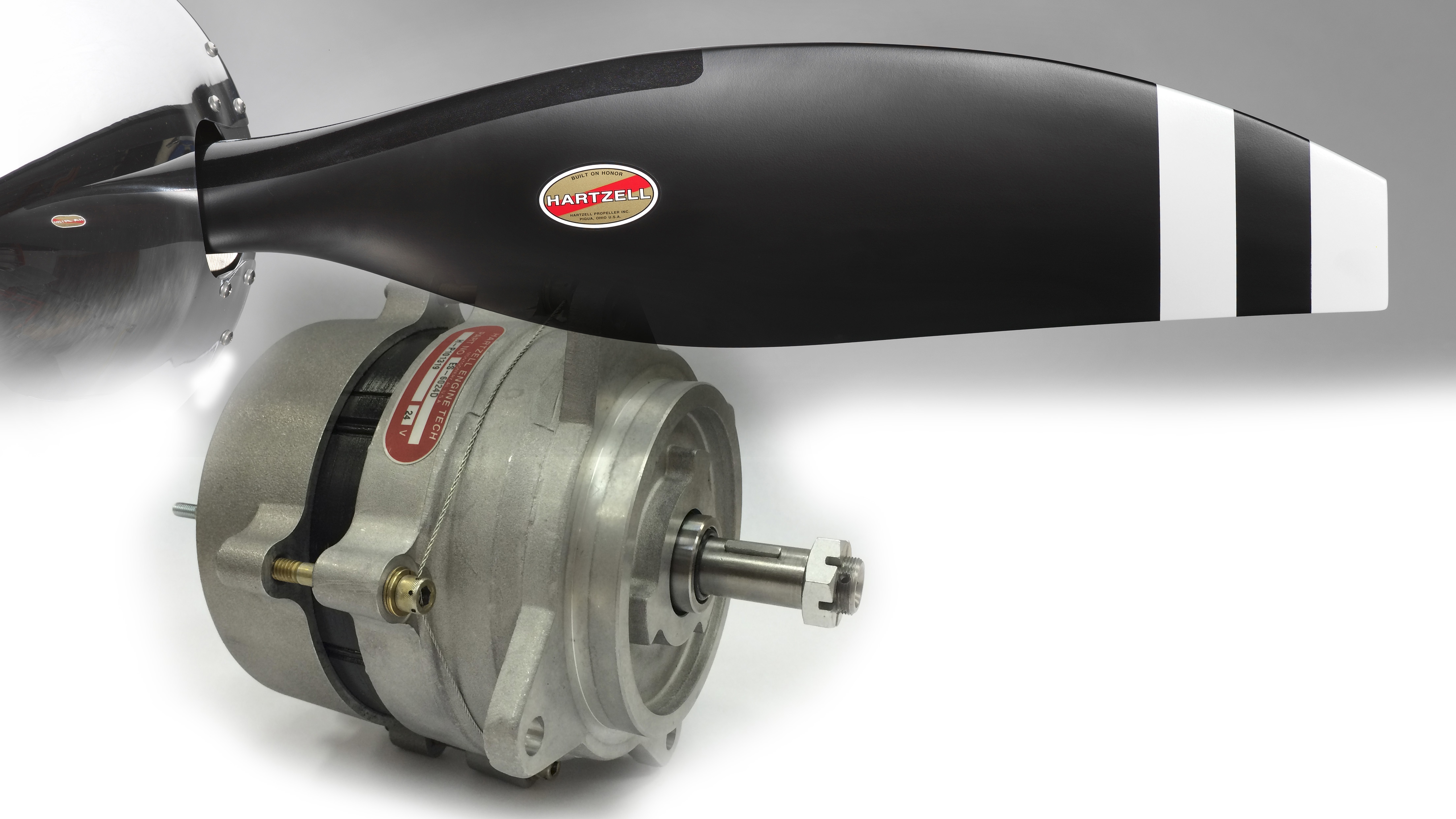 Hartzell Propeller extended the warranty on Top Prop conversion propellers through TBO effective July 1. Below, Hartzell Engine Technologies, a sister company owned by the same holding company, introduced new products including the ES-6024D 24-volt/60-amp alternator for six-cylinder Continental engines at EAA AirVenture. Photos courtesy of Hartzell Propeller and Hartzell Engine Technologies. 