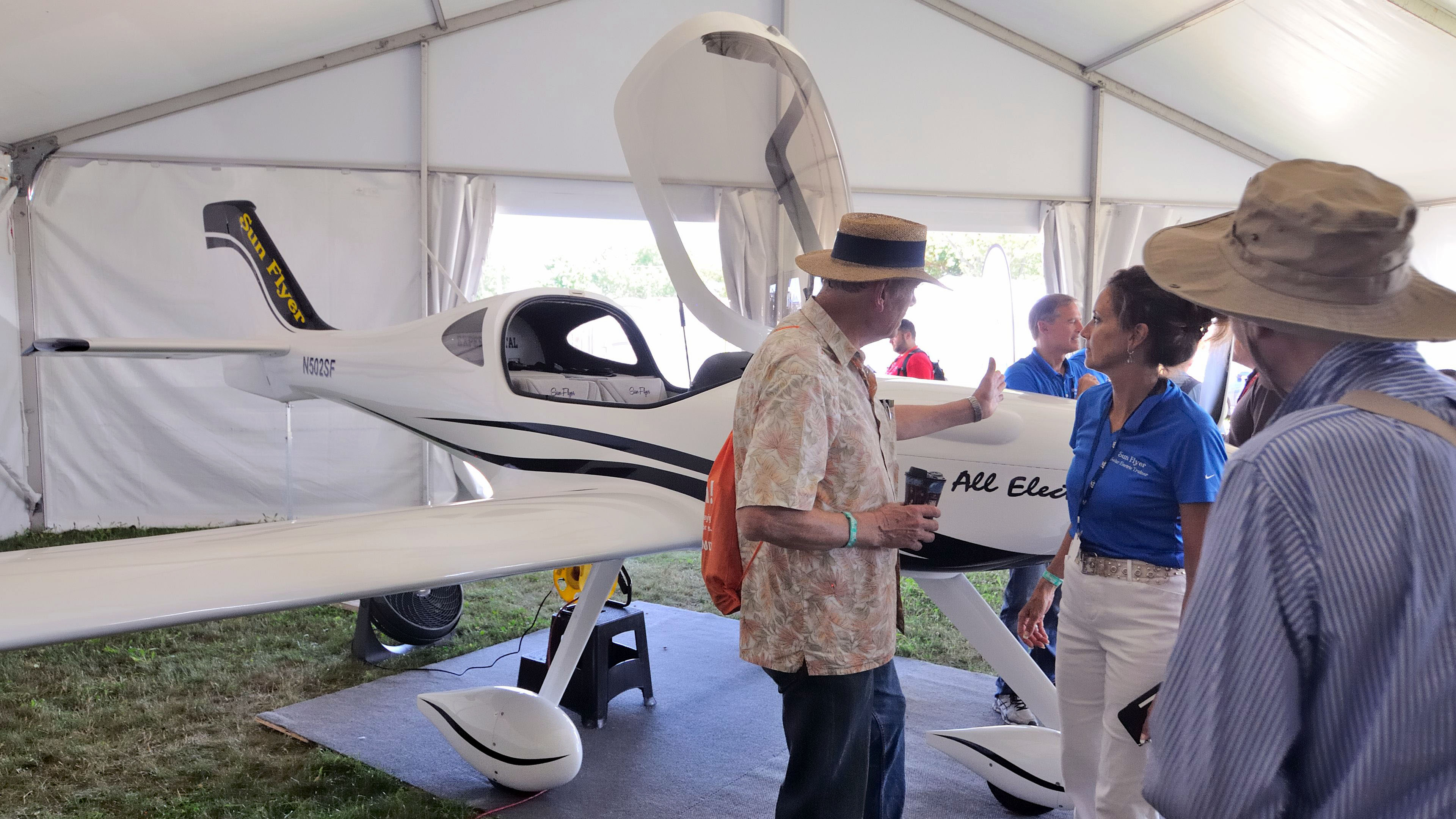 The Sun Flyer electric airplane is drawing a steady stream of people during AirVenture. Photo by Mike Collins.