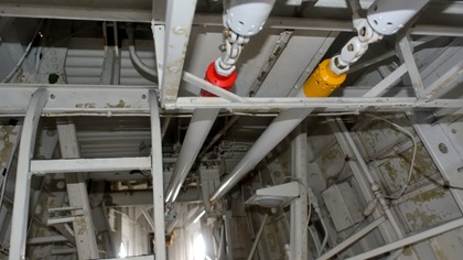 These massive, color-coded push rods control movement of the elevator (red) and rudder (yellow) of the only Martin Mars currently flying. Photo by Mike Collins.