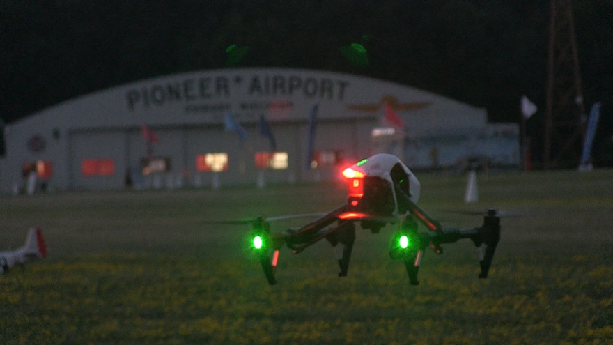 A DJI Inspire lifts off from the turf runway where EAA celebrates aviation's roots and history. Drones and other RC aircraft were invited to fly here in the evenings during AirVenture.