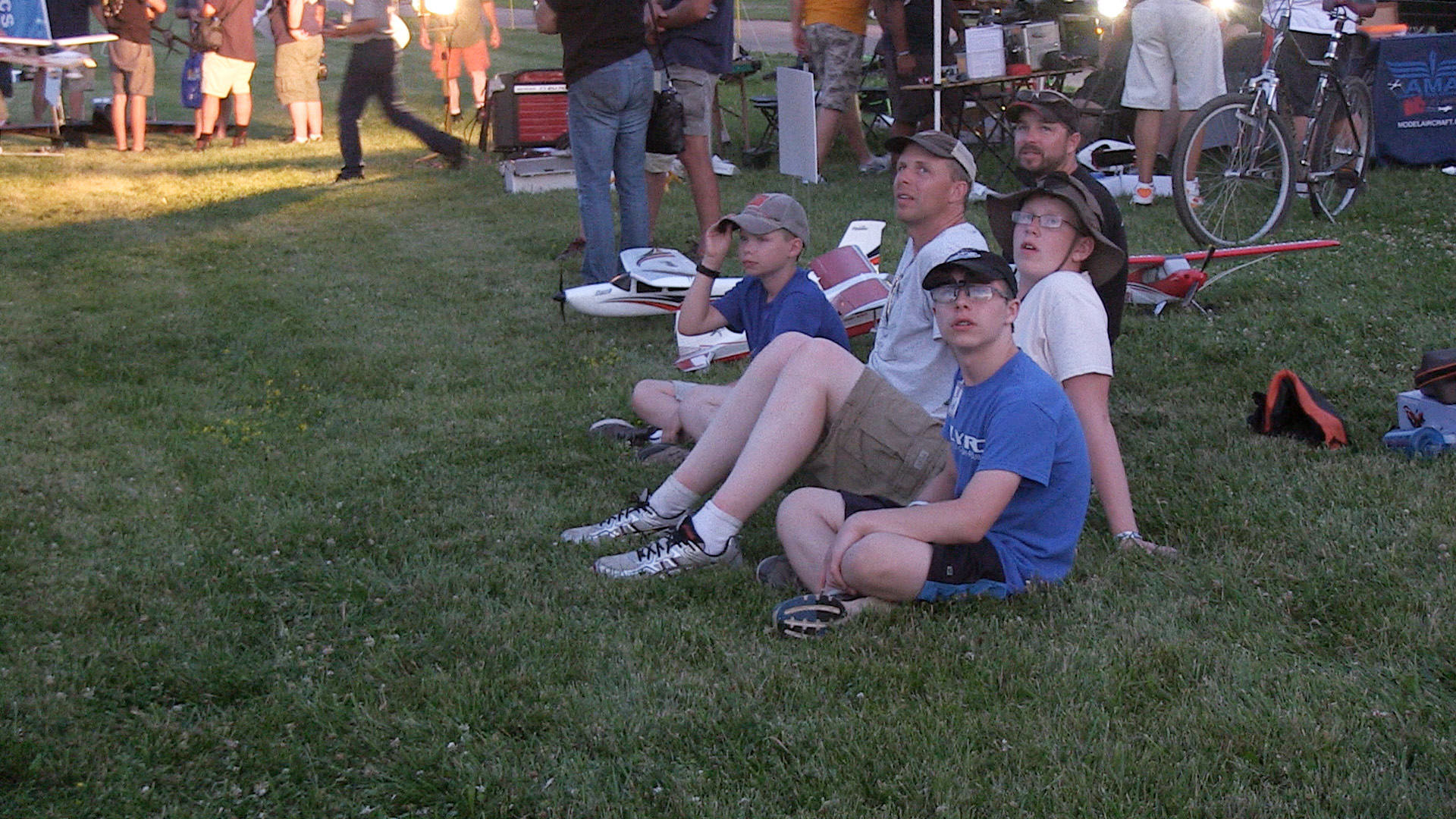 Spectators watch model aircraft and drones fly at Pioneer Airport during EAA AirVenture 2016. Jim Moore photo.