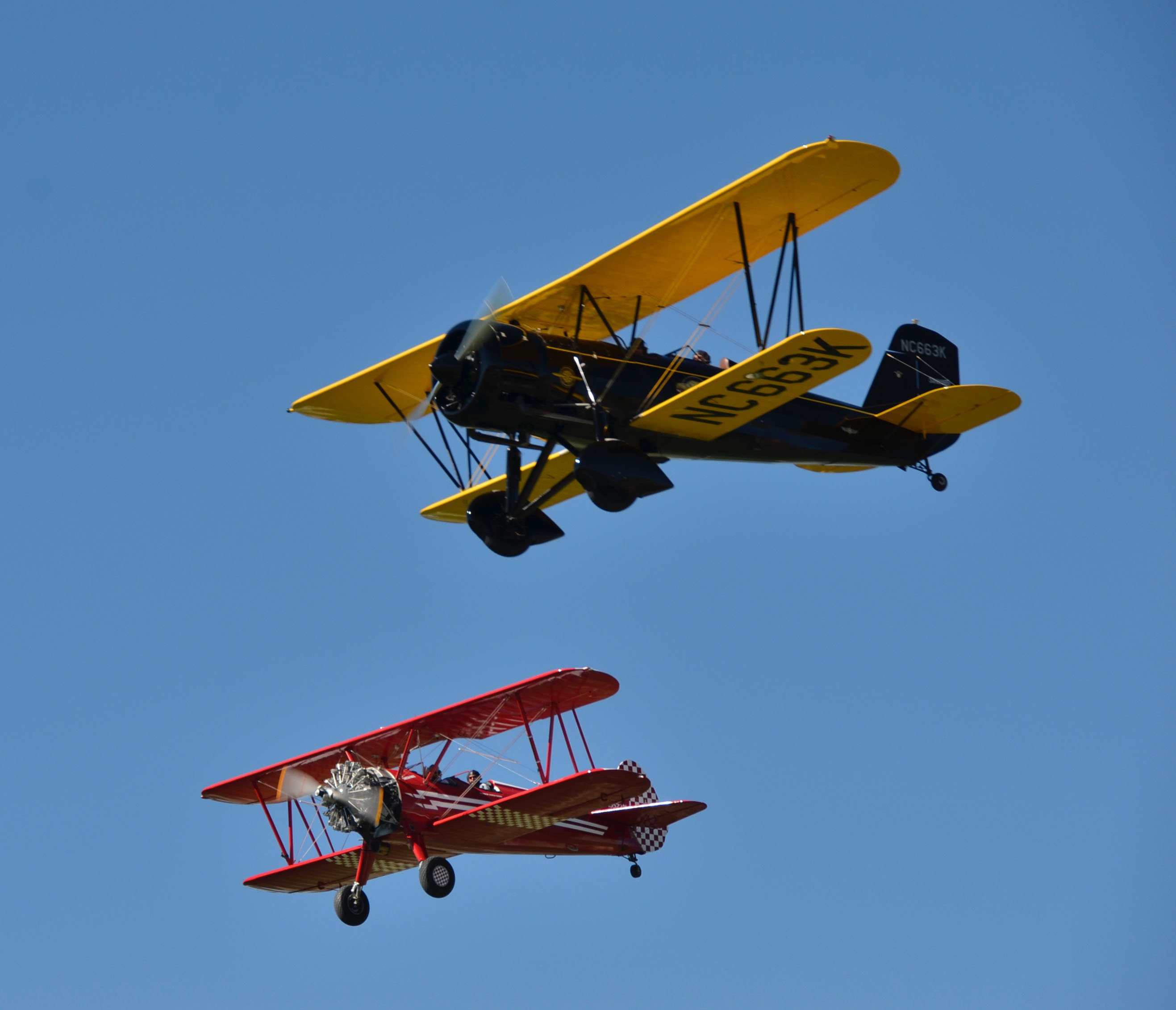 James Hoff's red and white Stearman formed up on Ben Scott's Speedmail for fly-bys at Rainbow Ranch in Idaho Falls. Round Up attendees were treated to an entire afternoon and evening of dozens of fly-bys from a number of antique aircraft operating off the 2,500 grass strip on the Hoffs' potato farm. Photo by Chris Eads.