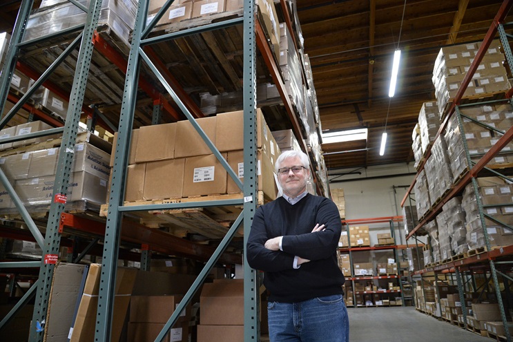 Aviation Supplies & Academics owner Mike Lorden, shown in the publication company's warehouse, has cleared shelf space for the new Airman Certification Standards handbooks. Photo by David Tulis.