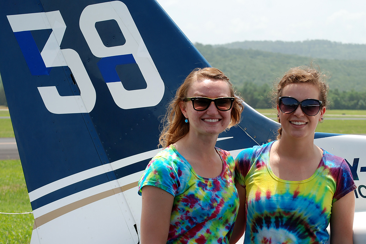 Team members in the annual all-female Air Race Classic pose for a photo near the numbered tail of their aircraft. Photo courtesy of the Air Race Classic.