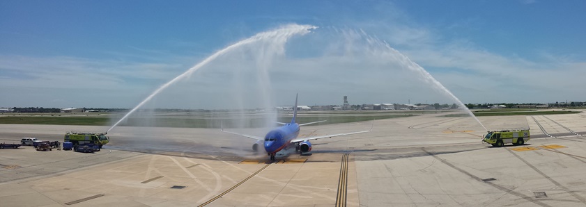 Debby Rihn-Harvey taxis a Southwest Airlines Boeing 737 through her celebratory and honorary water cannon/arch from Runway 4 to Gate 50 at Houston's William P. Hobby Airport. Photo by Yasmina Platt.