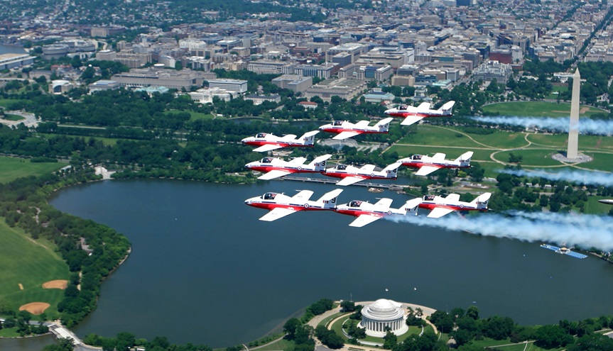 The Canadian Snowbirds aerial demonstration team performs a nine-ship friendship flyover of Washington, D.C. in their CT-114 Tutor jet aircraft before landing at Washington Dulles International Airport May 24. Photo courtesy of the Canada Department of National Defence.