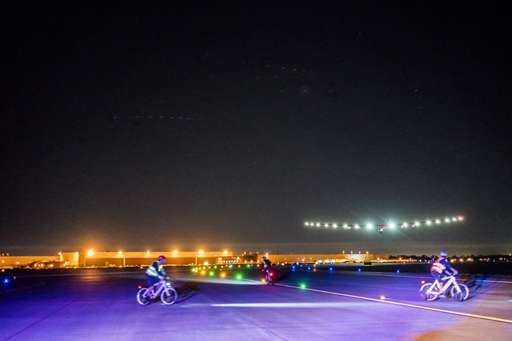 Ground crews on bicycles prepare to assist Solar Impulse 2 as Bertrand Piccard completes an 18-hour flight to Tulsa, Oklahoma. Photo courtesy of Solar Impulse.