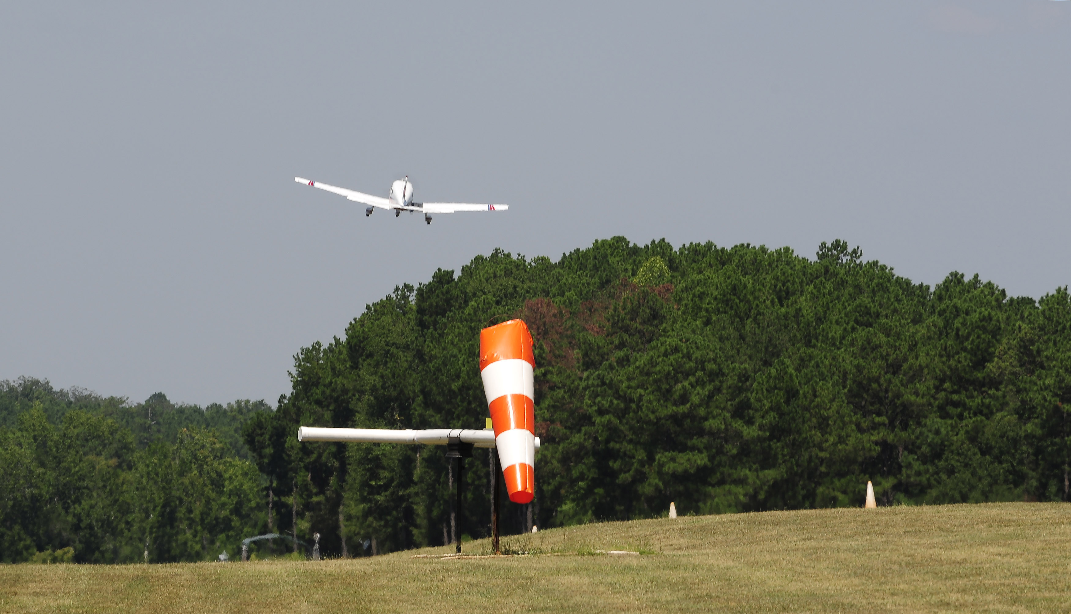 An aircraft takes off from Peach State Aerodrome's grass strip in Williamson, Georgia. Photo by David Tulis.                                                                                                                                                                                                                                                                                             