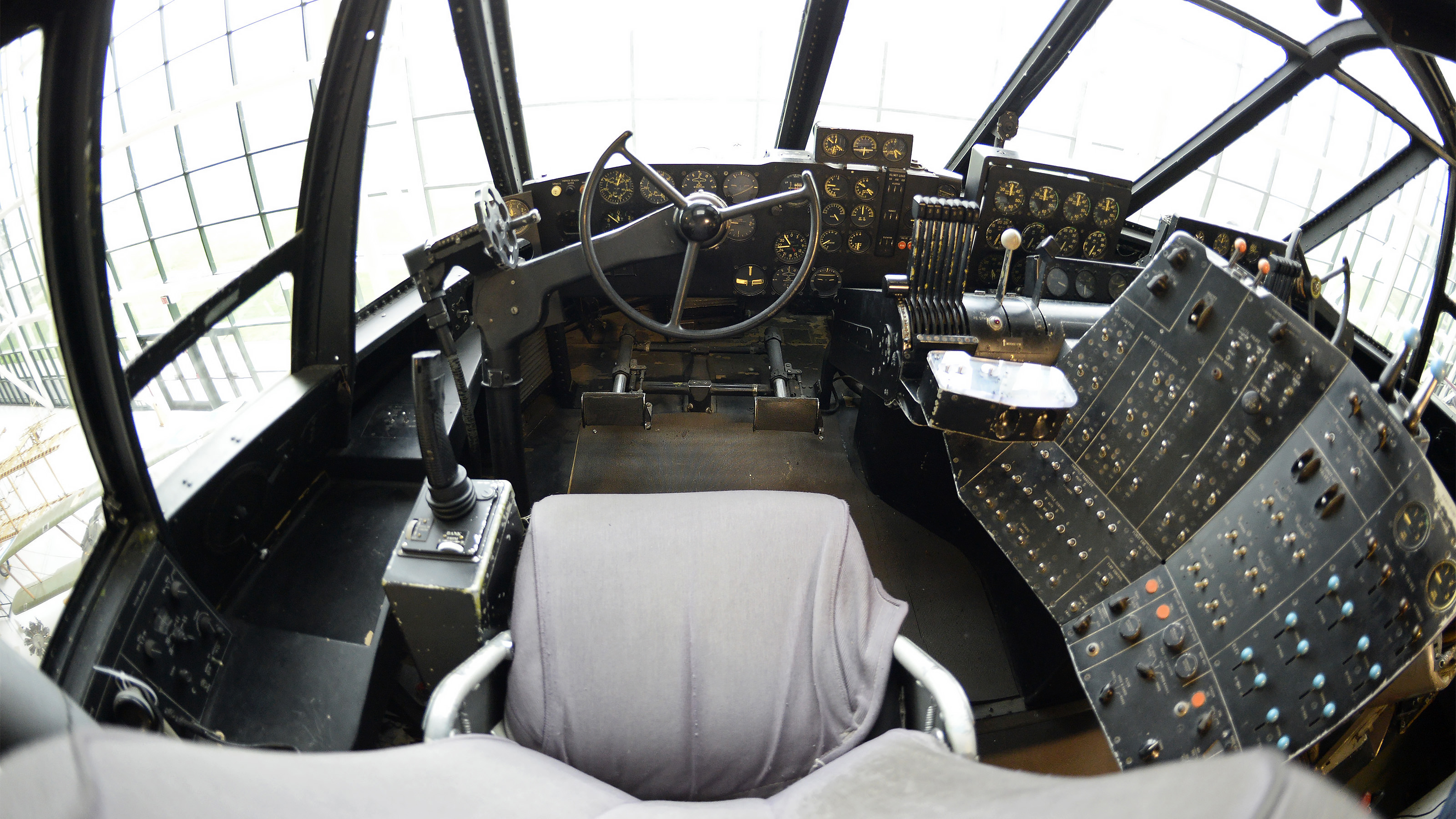 The view from Howard Hughes' H-4 Hercules cockpit is expansive, with four large windows, eight power levers, and hundreds of switches, dials, and gauges. Photo by David Tulis.
