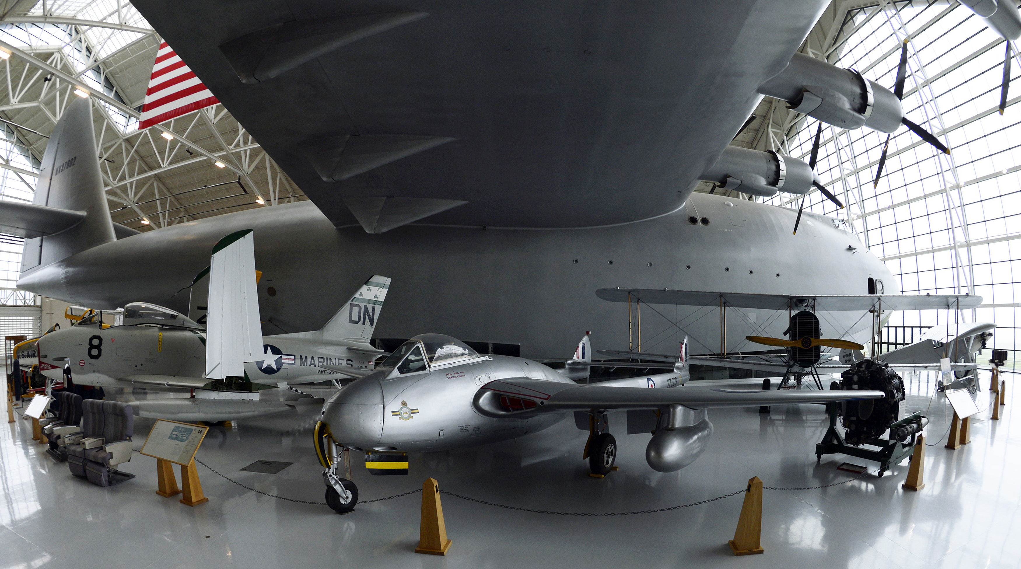 The Howard Hughes designed aircraft known as the 'Spruce Goose' is so large that six aircraft are tucked under its right wing alone. Photo by David Tulis.