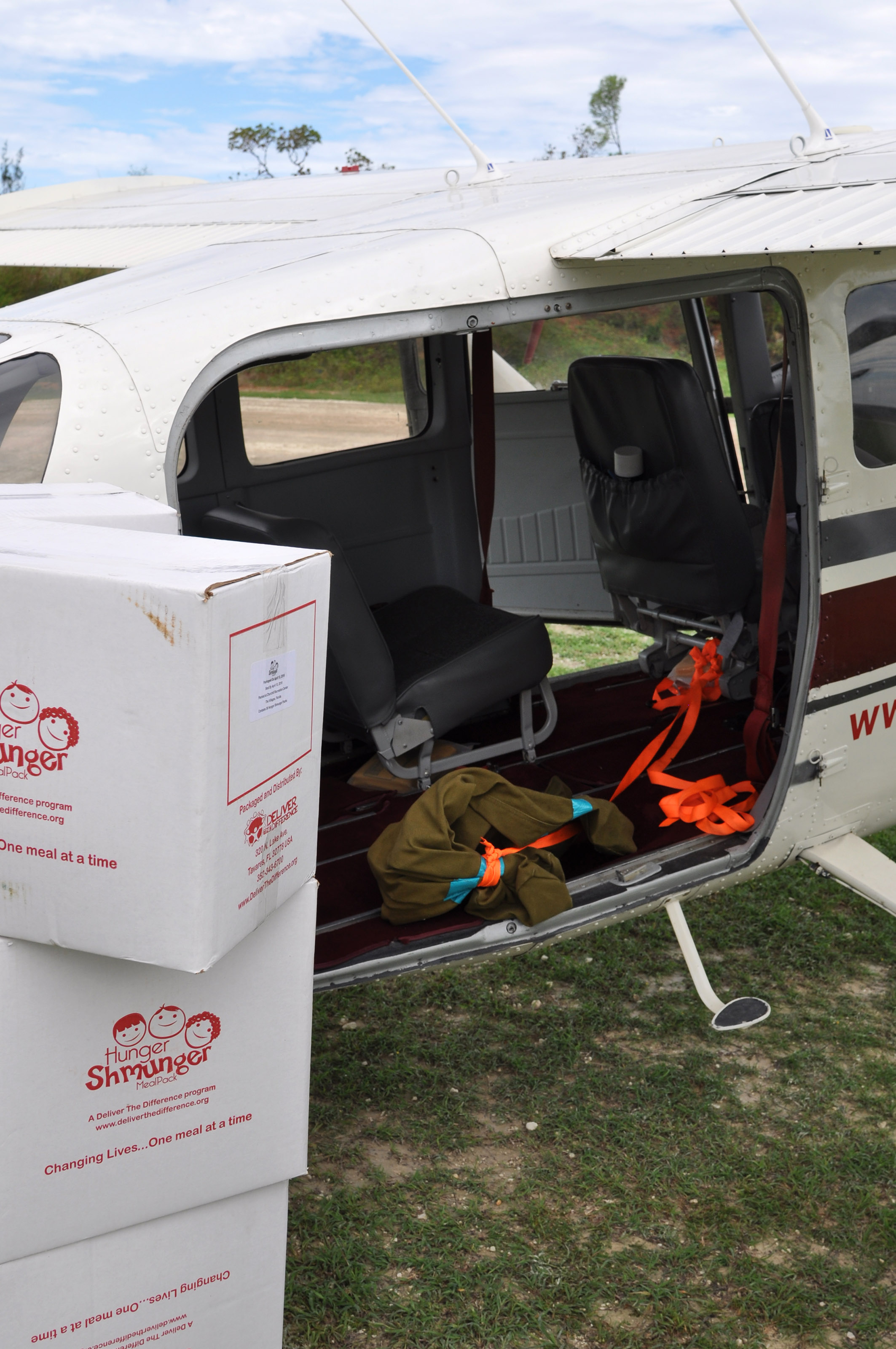 General aviation pilots deliver boxes of food to Haiti in the wake of Hurricane Matthew. Photo by Mark Evans.