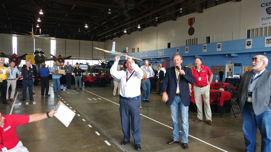 Piper CEO Simon Caldecott throws his team's entry into the airplane build competition during the annual Redbird Migration educational conference for flight training professionals, in San Marcos, Texas. Photo by Ian Twombly.