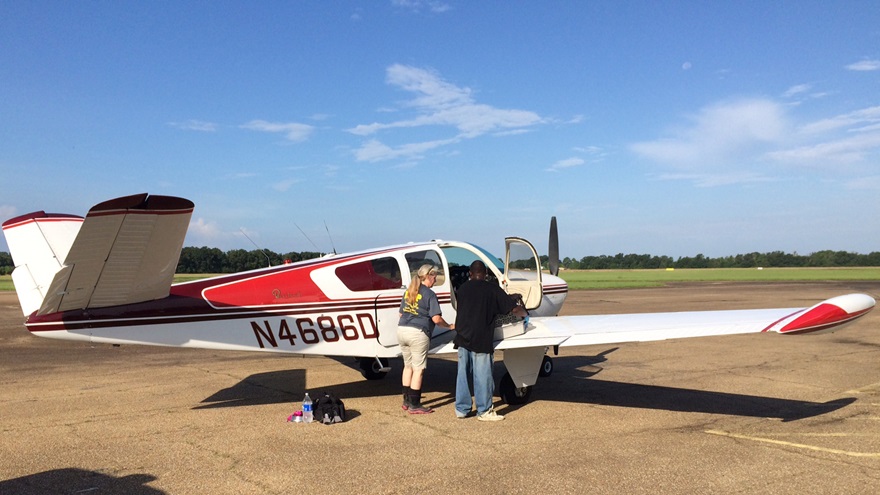 Rescued animals are loaded into a V-tail Bonanza. Photo by Paul McGhee.