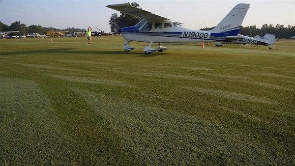 The manicured bentgrass turf runway and taxiways at Triple Tree Aerodrome are maintained with the precision of golf course greens. Photo by David Tulis.