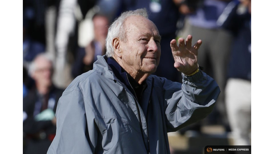 In 2015, Arnold Palmer waves from the 18th green during the Champion Golfers' Challenge tournament ahead of the British Open golf championship in St. Andrews, Scotland. Photo by REUTERS/Russell Cheyne.