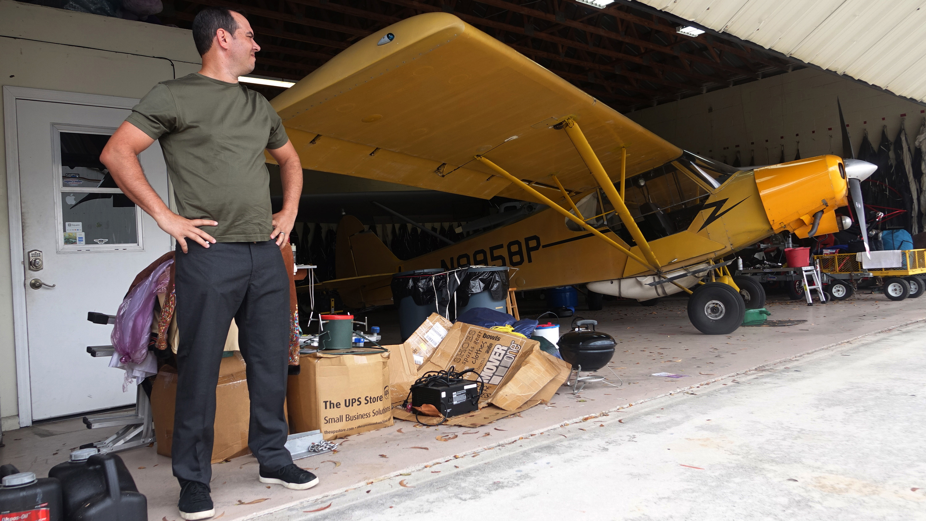 Jorge Gonzalez, of Skywords Advertising, is seen with his Piper Super Cub at the hangar he rents at Lantana Airport. Gonzalez said during a meeting with U.S. Rep. Lois Frankel that he might have to shutter his business if President Trump continues to visit Palm Beach and close the airspace on weekends. Courtesy of Joe Cavaretta, Fort Lauderdale Sun-Sentinel.