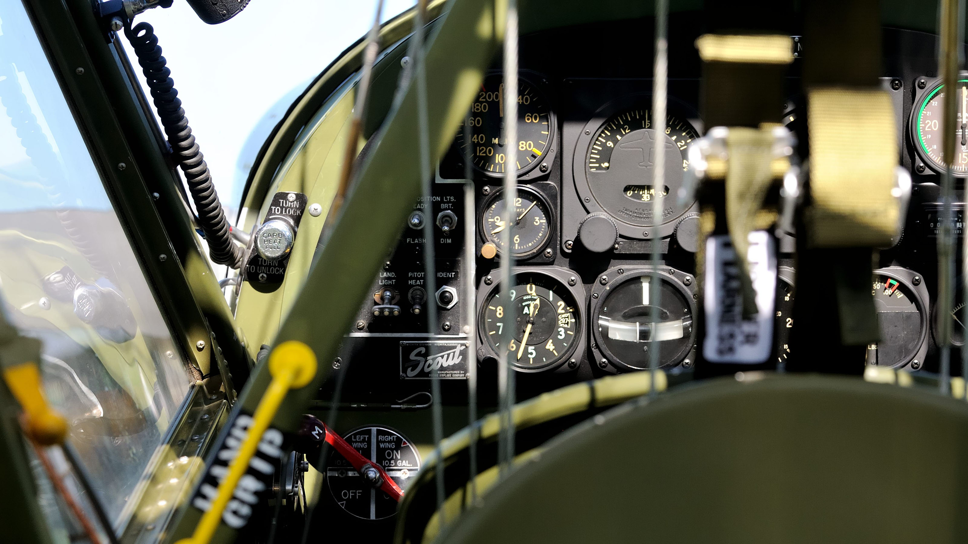 Exposed control cables run between the pilot's and observer's seats in Keith and Kathy Brunquists' Boeing YL-15 Scout prototype. The observer's seat can face aft or forward; dual controls allow the observer to fly when facing forward.