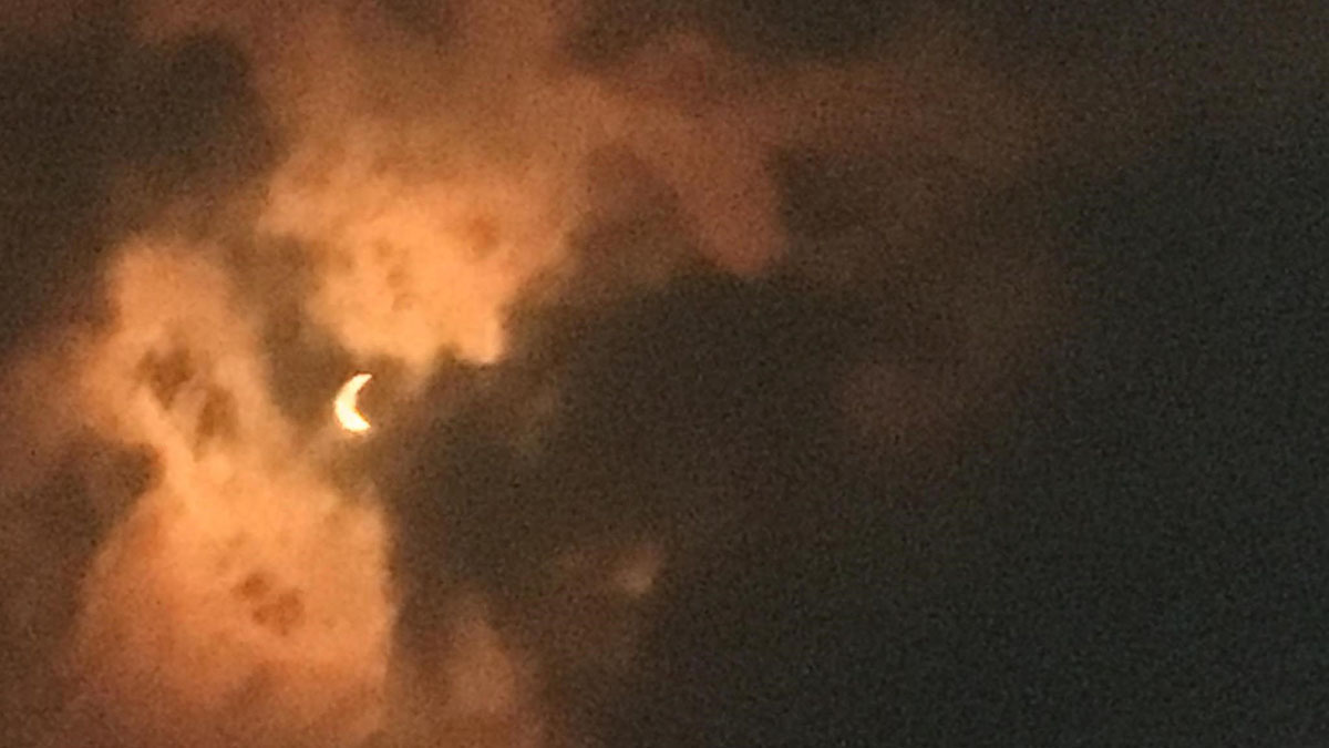 The sky darkens during the solar eclipse at Triple Tree Aerodrome in Woodruff, South Carolina. Photo by Chris Eads.