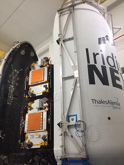 Iridium NEXT satellites, left center, are shown installed in the launcher and ready to be enclosed in the SpaceX rocket's payload capsule. One launch can place 10 of the satellites into orbit. Photo courtesy of Aireon.