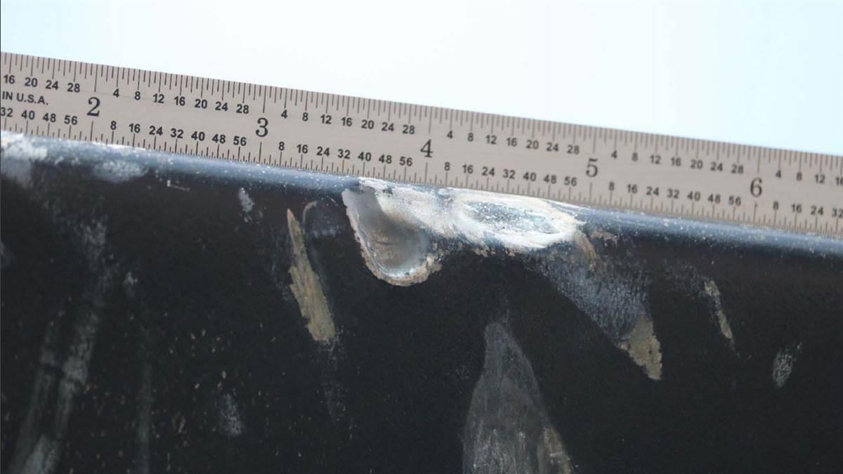Damage to the UH-60M main rotor blade caused by the impact of the DJI Phantom 4 drone required replacement of the rotor blade. NTSB photo.