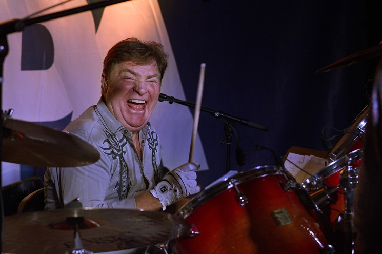 Nashville session musician and pilot Paul Leim plays the drums during the AOPA Fly-In Barnstormers Party in Tullahoma, Tennessee. Photo by David Tulis.