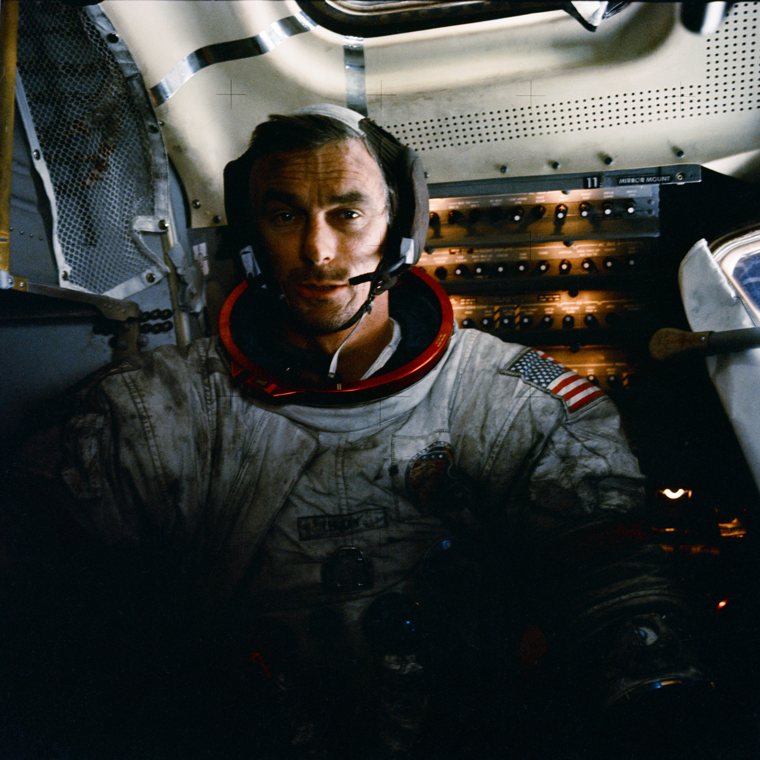Apollo 17 mission commander Eugene Cernan inside the lunar module on the moon after his second moonwalk of the mission. His spacesuit is covered with lunar dust. Photo courtesy of NASA.