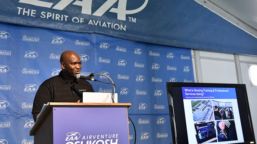 Boeing’s William Ampofo releases the manufacturer's 2017-2036 aviation jobs forecast during EAA AirVenture in Oshkosh, Wisconsin, July 24. Photo by David Tulis.