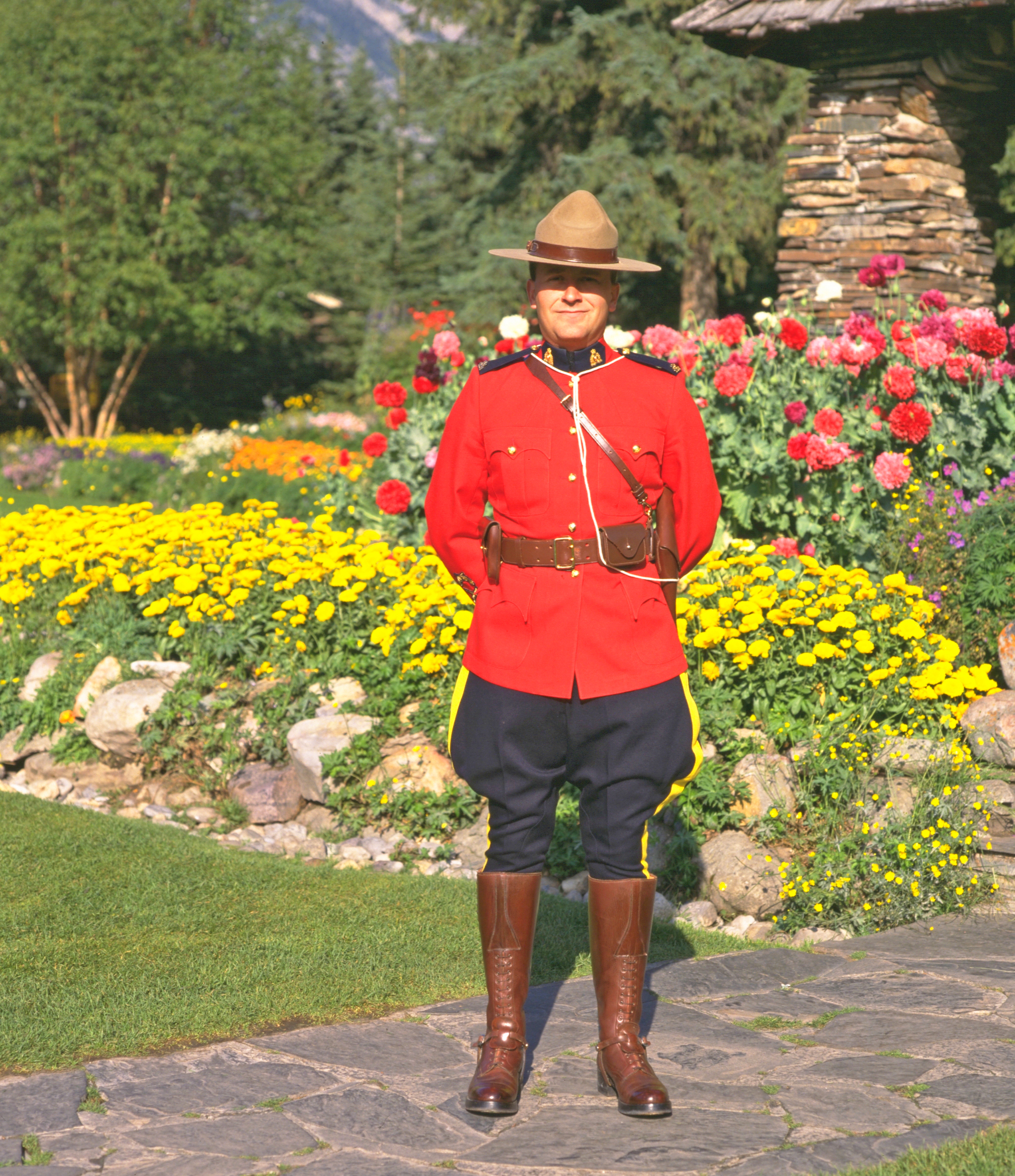 A Royal Canadian Mounted Police officer stands near the entrance to Cascade Gardens in downtown Banff. These lovely gardens are missed by many tourists, as they are tucked behind the Parks Canada administration office, near the south end of town. Photo courtesy Travel Alberta.
