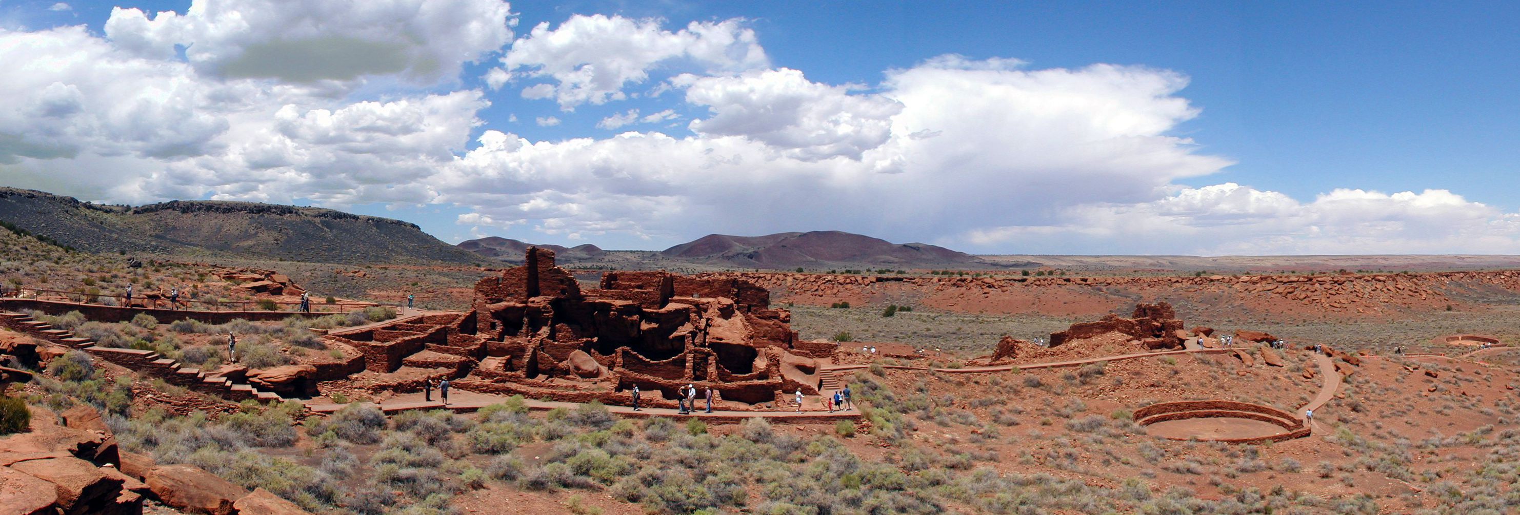 Panoramic view of the pueblo dwelling and other structures at Wupatki National Monument. Photo by Stephen McCluskey via Wikipedia.