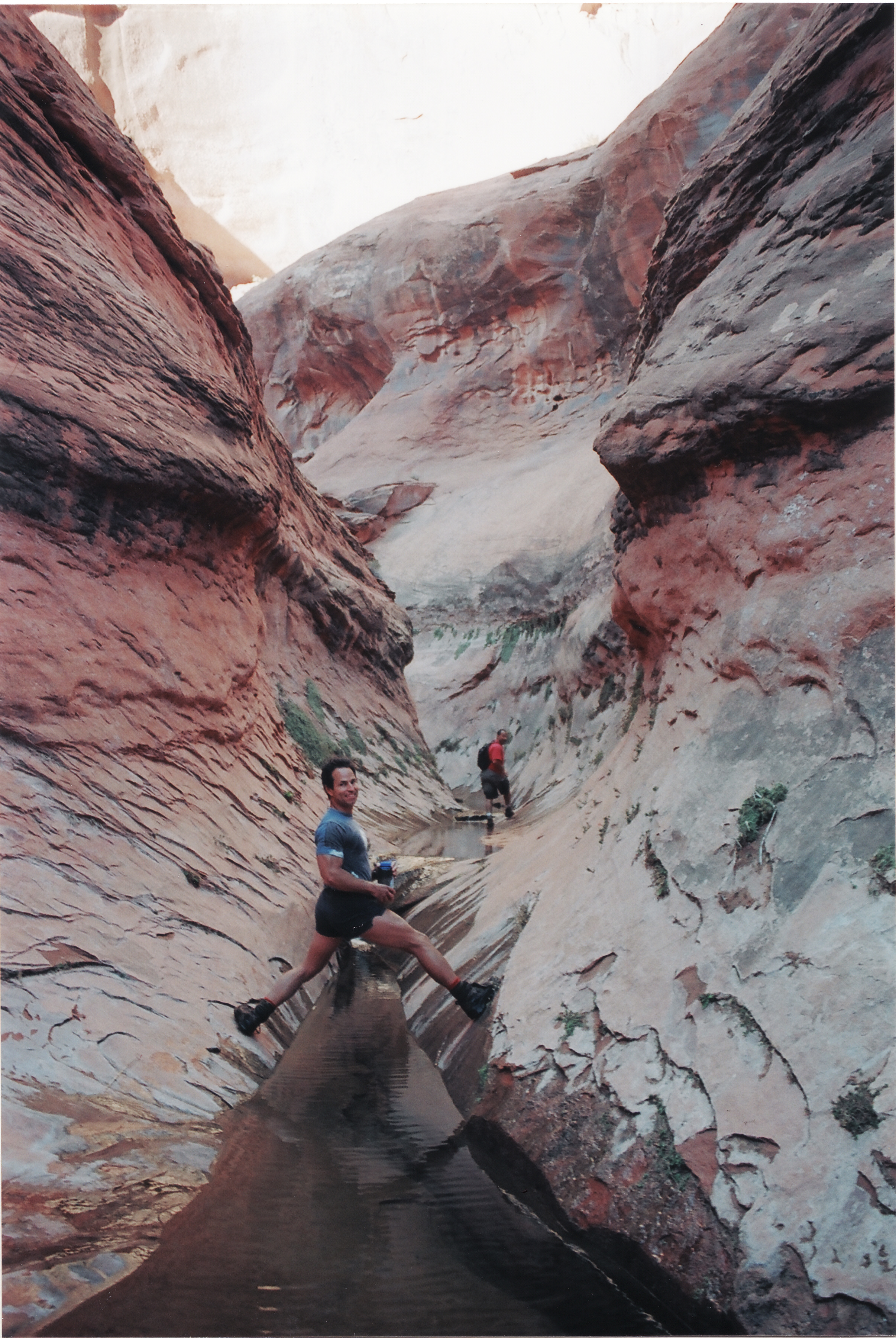 Fred Worthy and T.R. Goodman navigate the Bishop Creek Narrows off the Escalante River inside the Glen Canyon National Recreation Area. Photo by Crista Worthy.