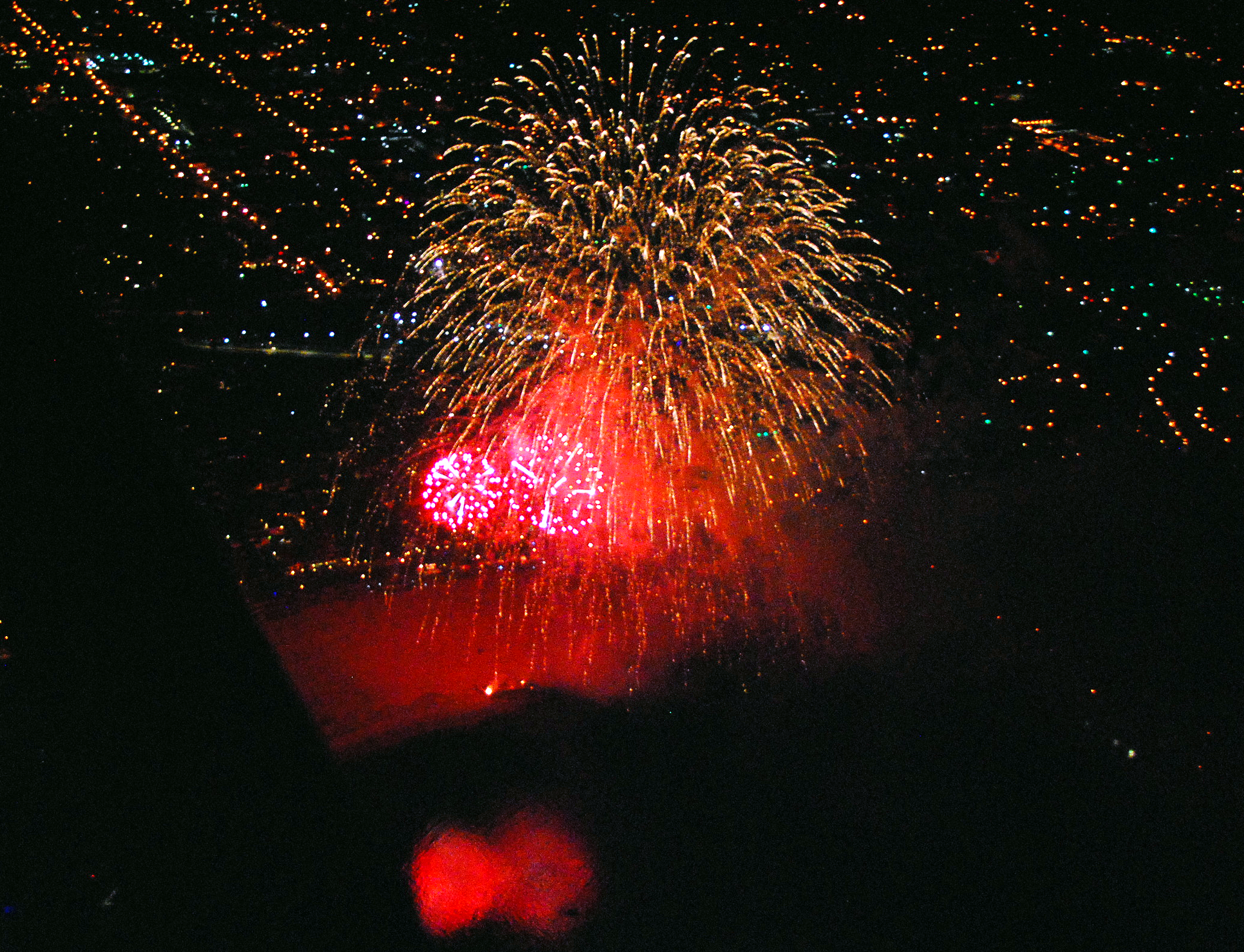 Fireworks explode just offshore of Santa Barbara, California, on July 4, 2010. Photo by John Wiley, ja4u.net.