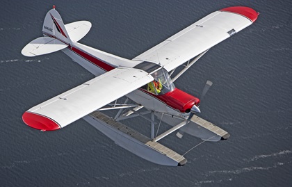 Mary Alverson flies her straight-float-equipped Super Cub above Gull Lake. Earn your seaplane rating with Mary in the Super Cub or a Cessna 172 on amphibious floats while your family enjoys the Madden’s on Gull Lake resort. Photo by Brad Thornberg.