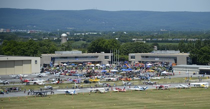 Aviation, automobile, and motorcycle aficionados attend the Wings 'n Wheels event near AOPA headquarters in Frederick, Maryland. Photo by David Tulis.