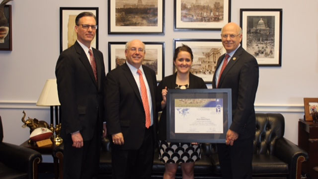 Rep. Steve Pearce (R-N.M.) was honored by the National Aeronautic Association with the Circumnavigator Diploma May 18 for his solo flight around the world. From left, A.W. Greenfield, NAA director of contest and records, AOPA's Scott Verstandig, AOPA's Katie McMichael, and Rep. Steve Pearce.