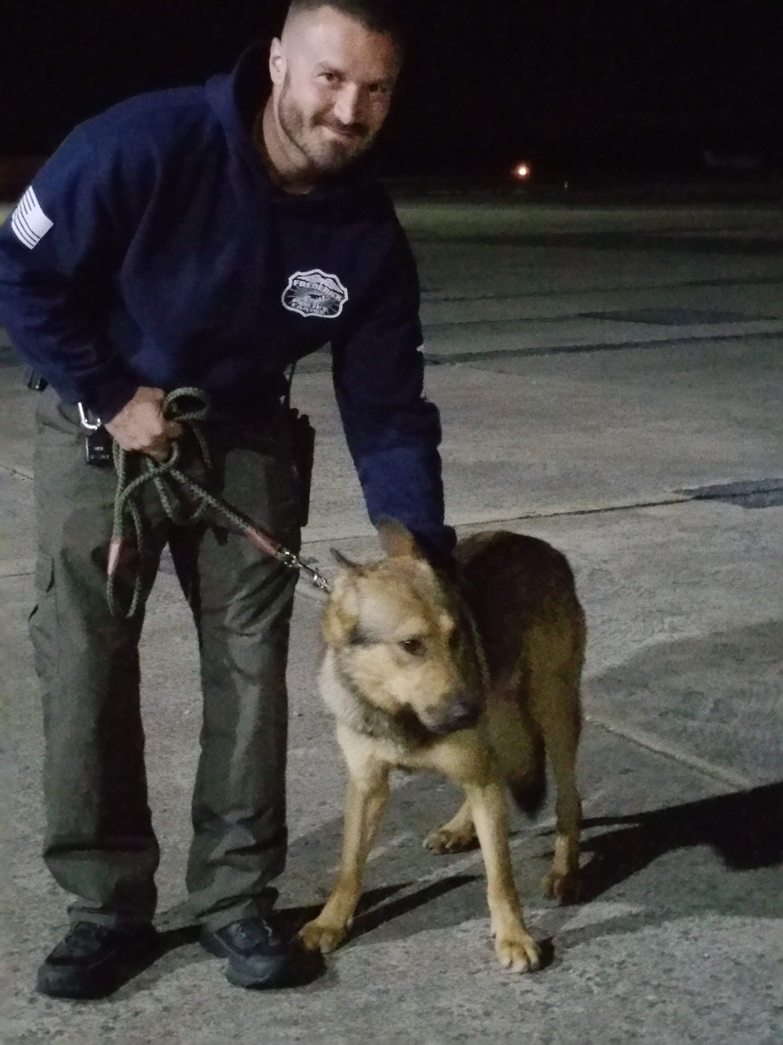 Frederick City Police Detective Pete Genovese holds Cesar after his flight from Orlando to Maryland. Photo courtesy K9 Unsung Heroes